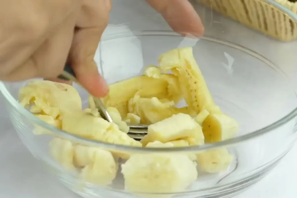 smashing bananas for banana bread