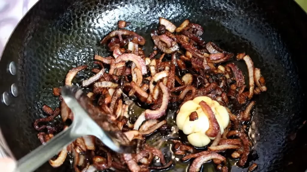 stir fry onions in the wok