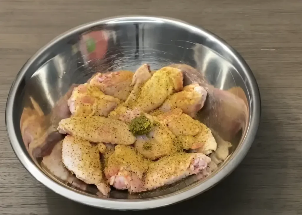 Seasoning chicken wings for the recipe