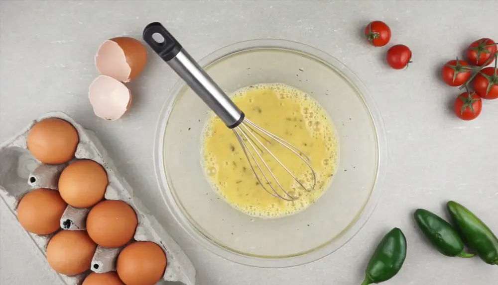 Whisk eggs and ingredients to make Egg Bites