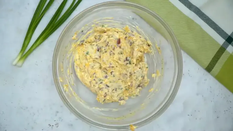 Mix the cheese spread for turkey pinwheels